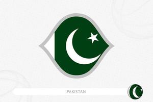 drapeau pakistanais pour la compétition de basket-ball sur fond gris de basket-ball. vecteur
