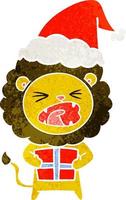 dessin animé rétro d'un lion avec un cadeau de noël portant un bonnet de noel vecteur