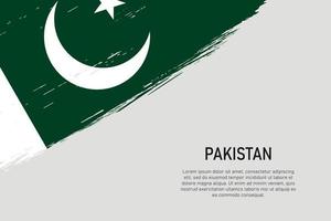 fond de coup de pinceau de style grunge avec le drapeau du pakistan vecteur