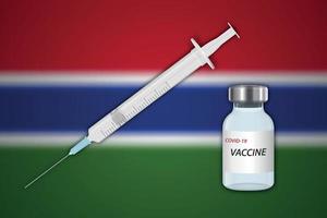 seringue et flacon de vaccin sur fond flou avec drapeau de la gambie, vecteur
