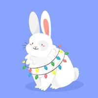 mignon lapin blanc avec une guirlande en style cartoon isolé sur le fond. illustration vectorielle de Noël. 2023 est la nouvelle année du lapin. vecteur