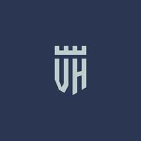 monogramme du logo vh avec un château de forteresse et un design de style bouclier vecteur