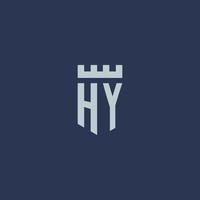 monogramme du logo hy avec un château de forteresse et un design de style bouclier vecteur