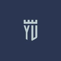 monogramme du logo yu avec un château de forteresse et un design de style bouclier vecteur