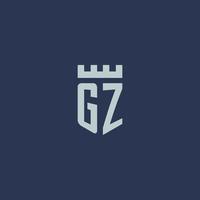 monogramme du logo gz avec un château de forteresse et un design de style bouclier vecteur