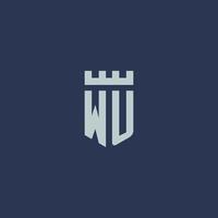 monogramme du logo wu avec un château de forteresse et un design de style bouclier vecteur
