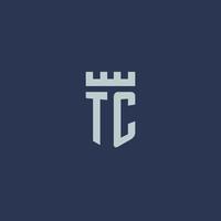 monogramme du logo tc avec un château de forteresse et un design de style bouclier vecteur