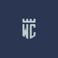 monogramme de logo wc avec château de forteresse et design de style bouclier vecteur