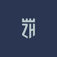 monogramme du logo zh avec un château de forteresse et un design de style bouclier vecteur