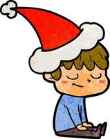 dessin animé texturé d'un garçon heureux portant un bonnet de noel vecteur