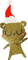 dessin animé rétro paisible d'un ours portant un bonnet de noel vecteur