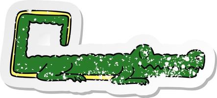 autocollant en détresse d'un crocodile de dessin animé original dessiné à la main vecteur