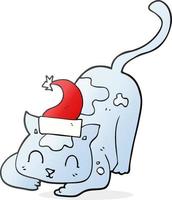 chat de dessin animé dessiné à main levée portant un chapeau de noël vecteur