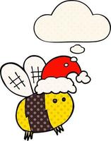 abeille de dessin animé mignon portant un chapeau de noël et une bulle de pensée dans le style de la bande dessinée vecteur