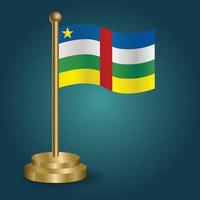 drapeau national de l'afrique centrale sur le poteau d'or sur fond sombre isolé de gradation. drapeau de table, illustration vectorielle vecteur