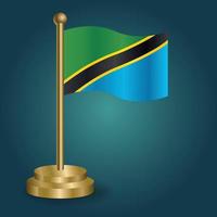 drapeau national de la tanzanie sur le poteau d'or sur fond sombre isolé de gradation. drapeau de table, illustration vectorielle vecteur