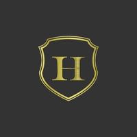 initiales h élégant logo doré vecteur