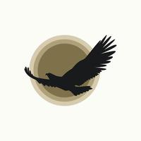 oiseau volant simple et unique ou aigle avec la lune ou le soleil derrière l'image graphique icône logo design abstrait concept vecteur stock. peut être utilisé comme symbole lié à l'animal ou à la liberté