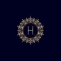 h logo de luxe royal orné d'or vecteur