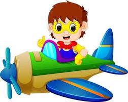 garçon de super-héros à bord d'un avion volant vecteur