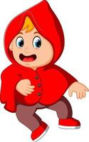 mignon enfant sorcière marchant dans un manteau rouge vecteur