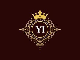 lettre yi logo victorien de luxe royal antique avec cadre ornemental. vecteur