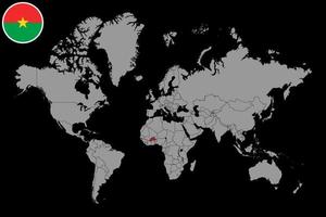 épinglez la carte avec le drapeau du burkina faso sur la carte du monde. illustration vectorielle. vecteur