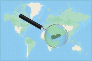 carte du monde avec une loupe sur une carte du yémen. vecteur