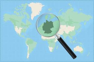 carte du monde avec une loupe sur une carte de l'allemagne. vecteur