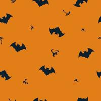 modèle sans couture avec silhouette de chauve-souris sur fond orange. vecteur