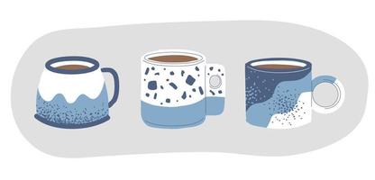 un ensemble de tasses faites à la main. thé et café dans de belles tasses élégantes. motifs sur plats en céramique vecteur