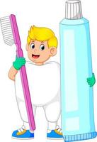 un homme portant un costume de dent et tenant une grosse brosse à dents et un gros dentifrice vecteur