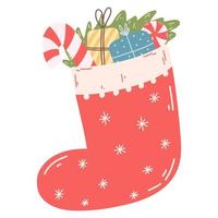 chaussette de noël avec des cadeaux et des bonbons dans un style plat de dessin animé. illustration vectorielle dessinée à la main d'un élément de décor festif traditionnel vecteur