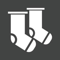 icône inversée de glyphe de chaussettes vecteur