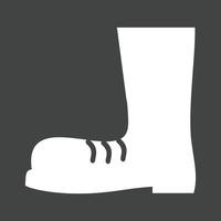 icône inversée de glyphe de bottes de construction vecteur
