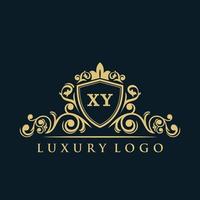 logo lettre xy avec bouclier d'or de luxe. modèle vectoriel de logo d'élégance.