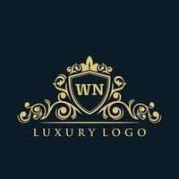 lettre wn logo avec bouclier d'or de luxe. modèle vectoriel de logo d'élégance.