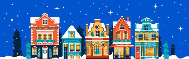 bannière de noël avec des maisons décorées de couleurs vives avec des guirlandes. façades plates avec sapins de noël et neige