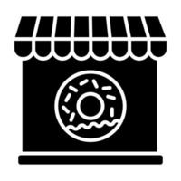 icône de glyphe de magasin de beignets vecteur