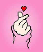 Pixel 8 bits de l'image du cœur du doigt. illustration vectorielle de pixel art. illustration vectorielle de signe d'amour coréen. vecteur