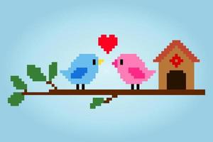 8 bits pixels une paire d'oiseaux. animaux pour les actifs de jeu et les motifs de point de croix dans les illustrations vectorielles. vecteur