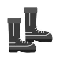 icône plate en niveaux de gris de bottes vecteur