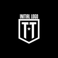 logo de jeu initial tt avec design de style bouclier et étoile vecteur