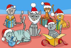 groupe de personnages de chats et de chatons de dessin animé le temps de noël vecteur