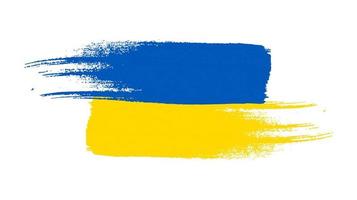 drapeau national ukrainien dans le style grunge. peint avec un drapeau de coup de pinceau de l'ukraine. illustration vectorielle vecteur