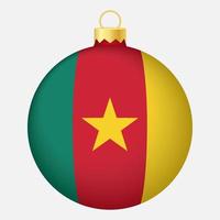 boule de sapin de noël avec le drapeau camerounais. icône pour les vacances de noël vecteur