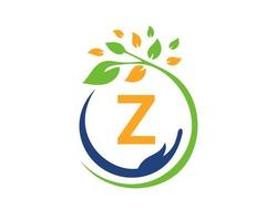logo de charité lettre z avec main, feuille et concept. logotype de la fondation pour le soin des mains vecteur