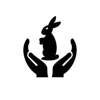 création de logo de lapin à la main. logo de lapin avec vecteur de concept de main. création de logo main et lapin