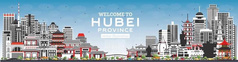 bienvenue dans la province du hubei en chine. toits de la ville avec des bâtiments gris et un ciel bleu. vecteur