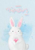 lapin blanc étreignant le coeur dans un style aquarelle avec le libellé de la saint-valentin sur fond de papier bleu. carte de voeux Saint Valentin en dessin vectoriel. vecteur